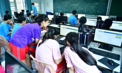 adults learning computer skills in a training classroom