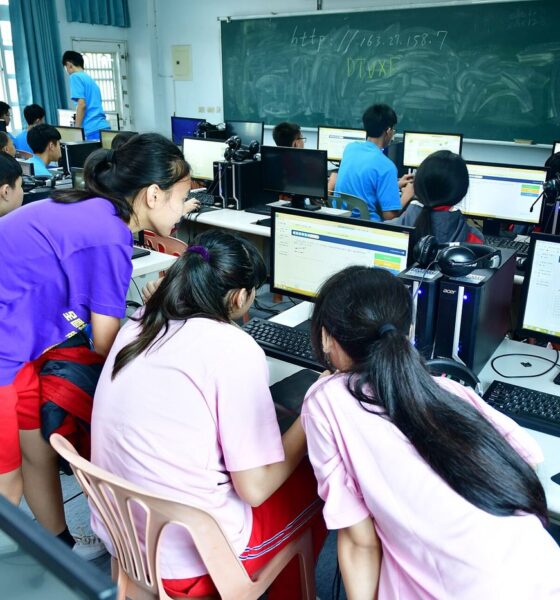 adults learning computer skills in a training classroom