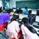 adults learning computer skills in a training classroom