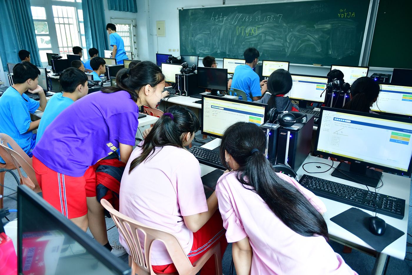 adults learning computer skills in a training classroom
